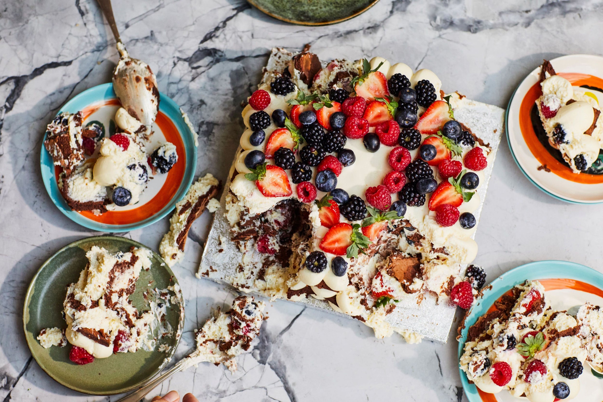 Flourless chocolate celebration cake with mascarpone cream and berries.