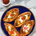 Adjaruli khachapuri with aleppo chilli and spring onion butter