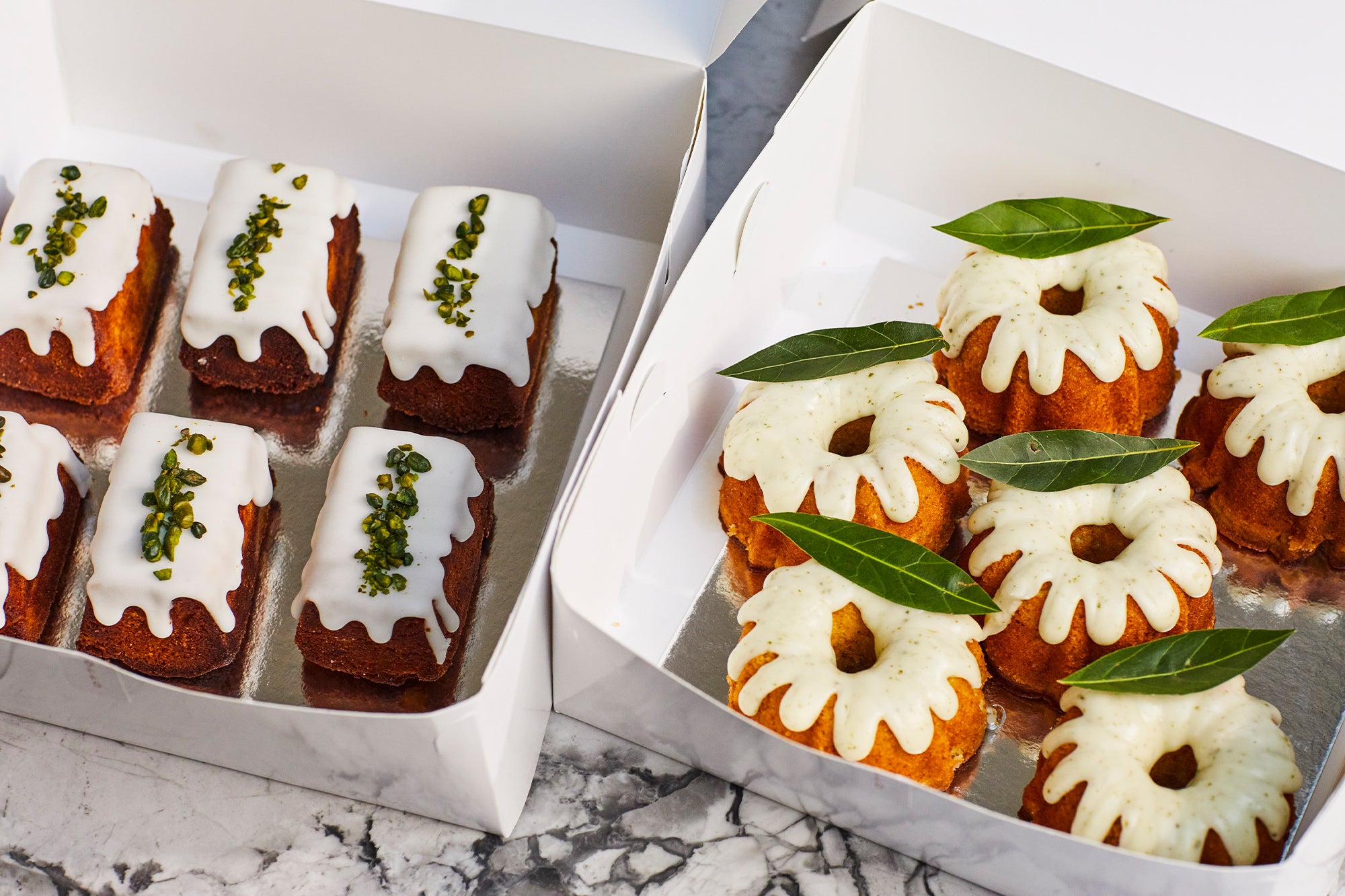 Boxes with cakes: Sicilian lemon and bay leaf teacake, flourless lemon polenta with pistachio.