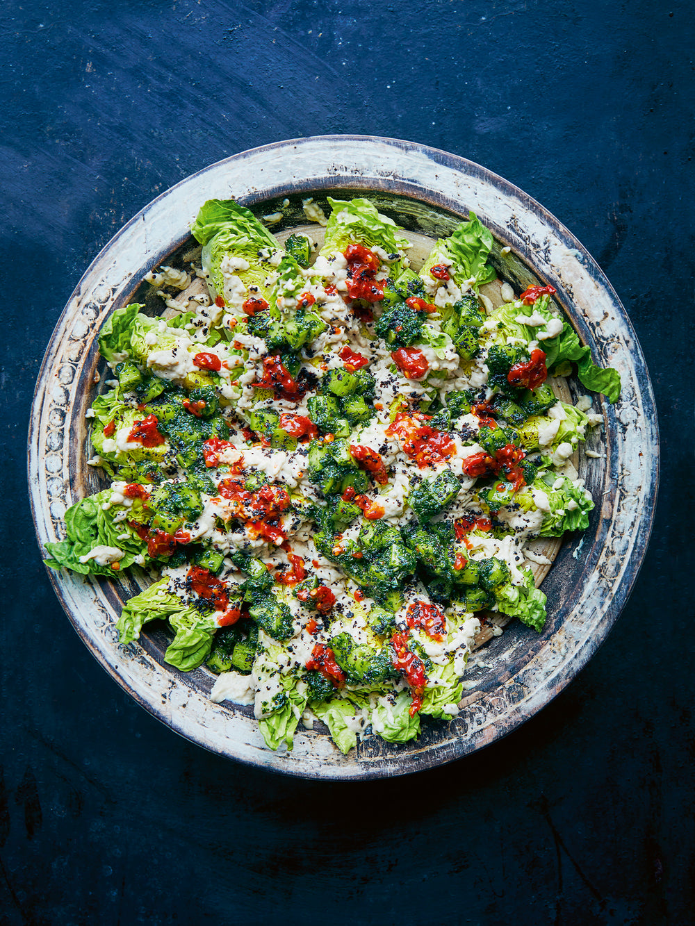 Baby gem lettuce with burnt aubergine yoghurt, smacked cucumber and shatta