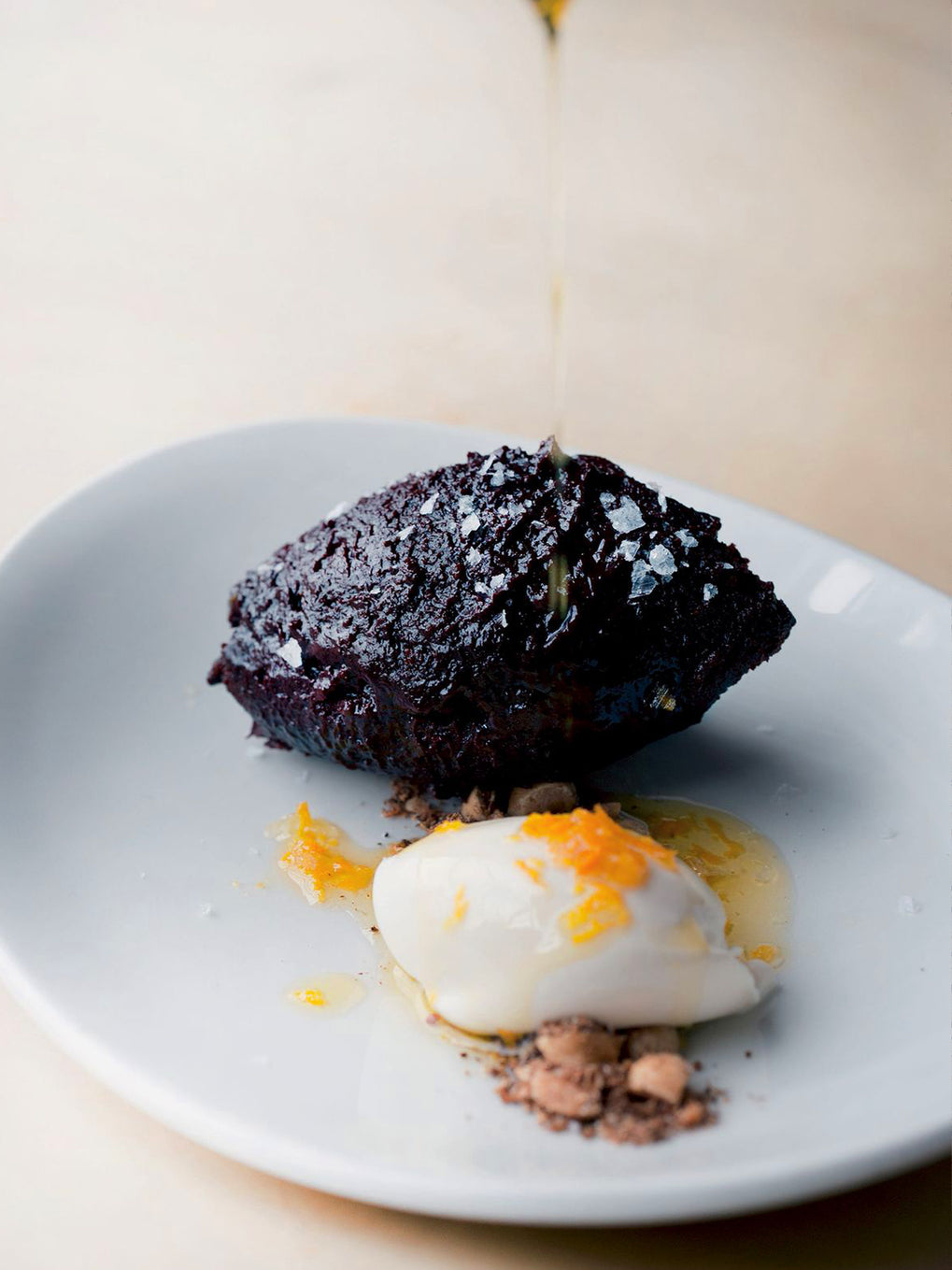 Baked chocolate ganache with spicy hazelnuts and orange oil