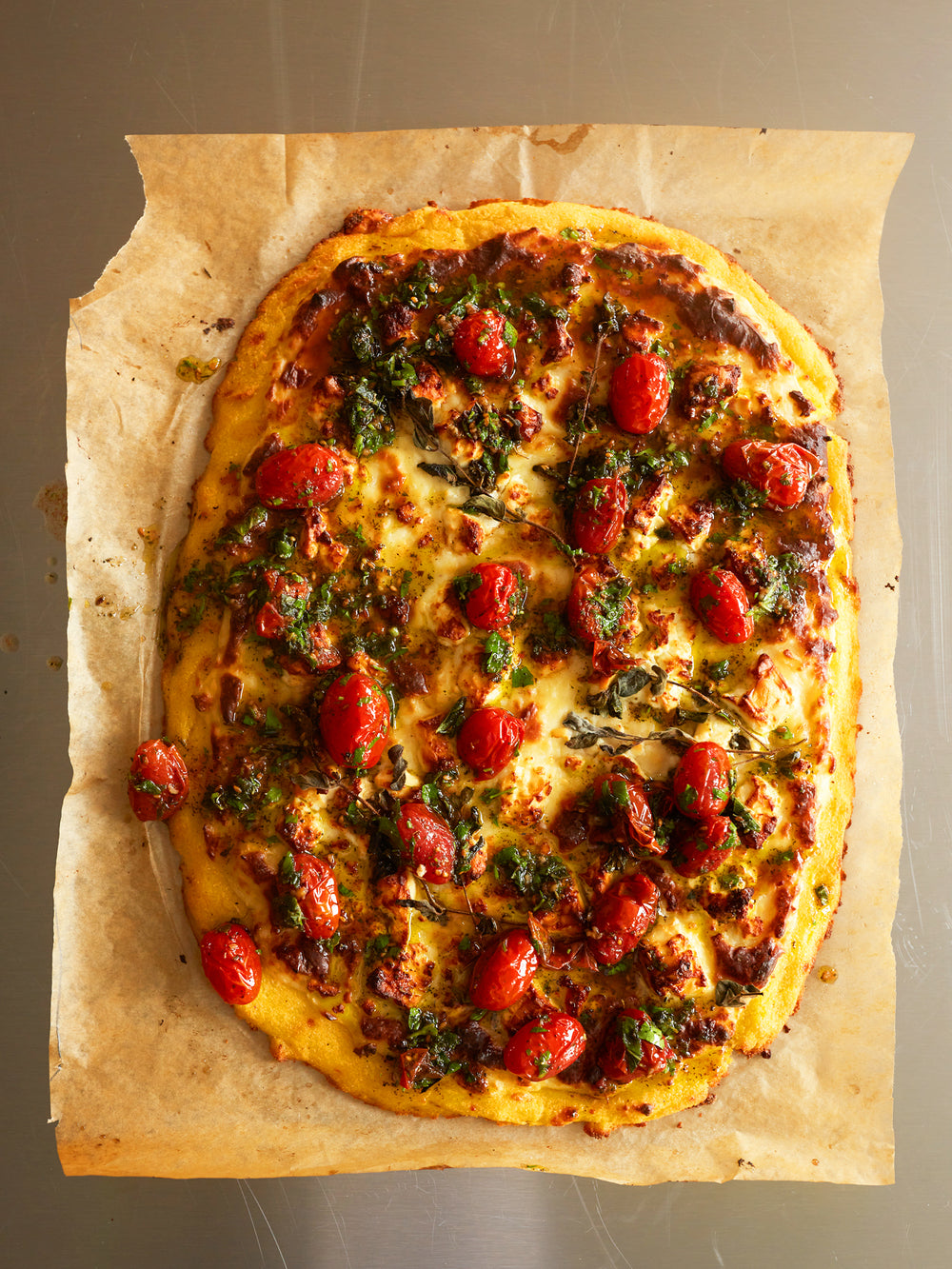 Baked polenta with feta, béchamel and za'atar tomatoes