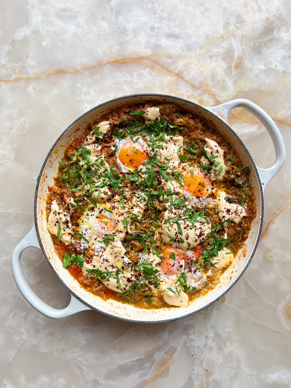 Braised eggs with beef, smoked aubergine and tomato