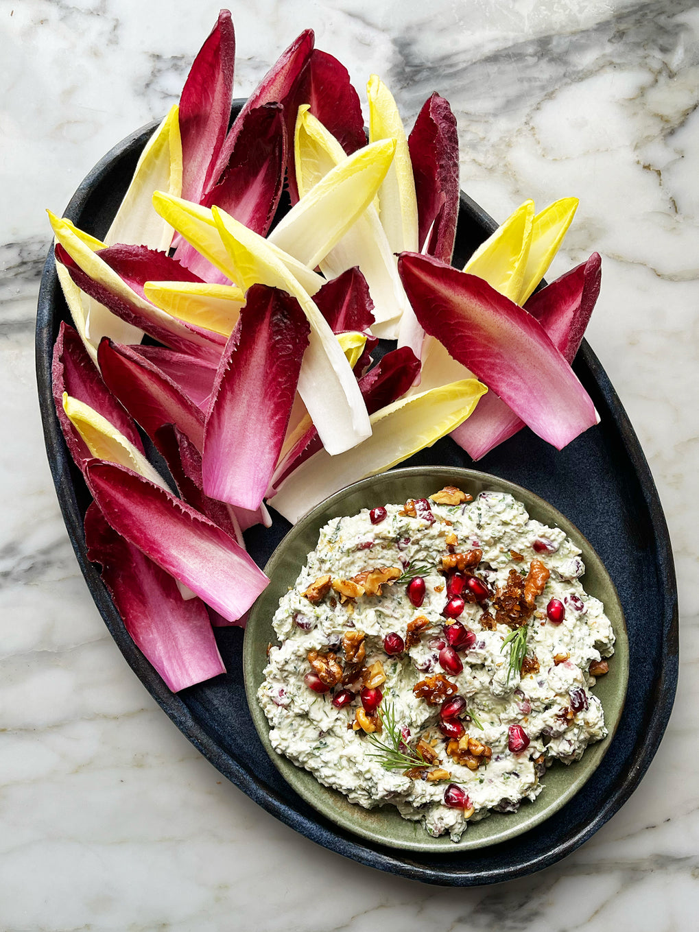 Chicory boats with feta, walnut and pomegranate