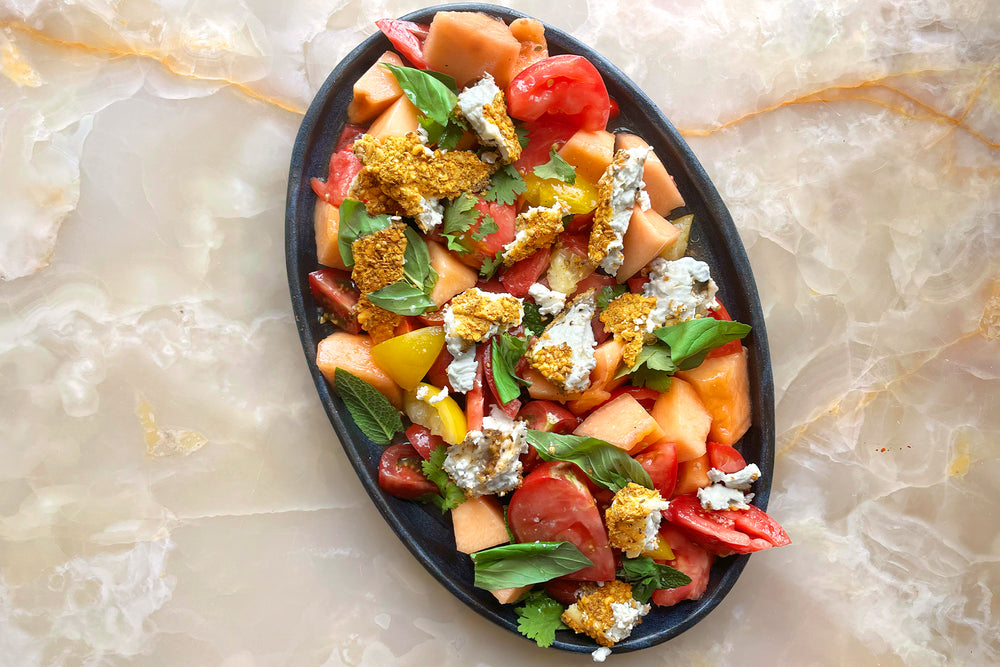 Dukkah crusted feta with heritage tomatoes and melon salad