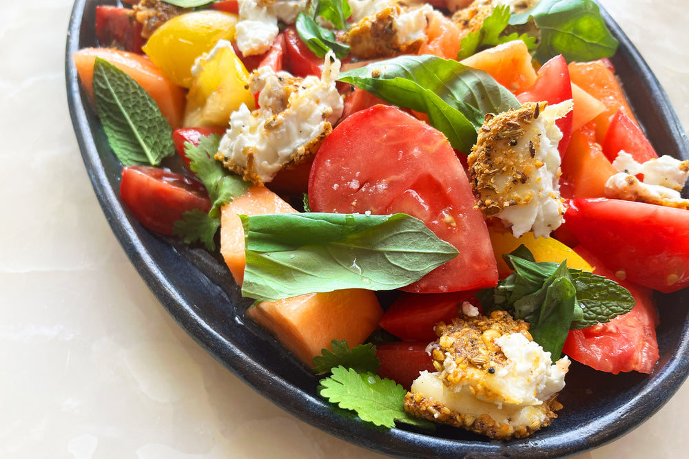 Dukkah crusted feta with heritage tomatoes and melon salad