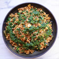 Giant couscous with golden raisins, lemon and almonds