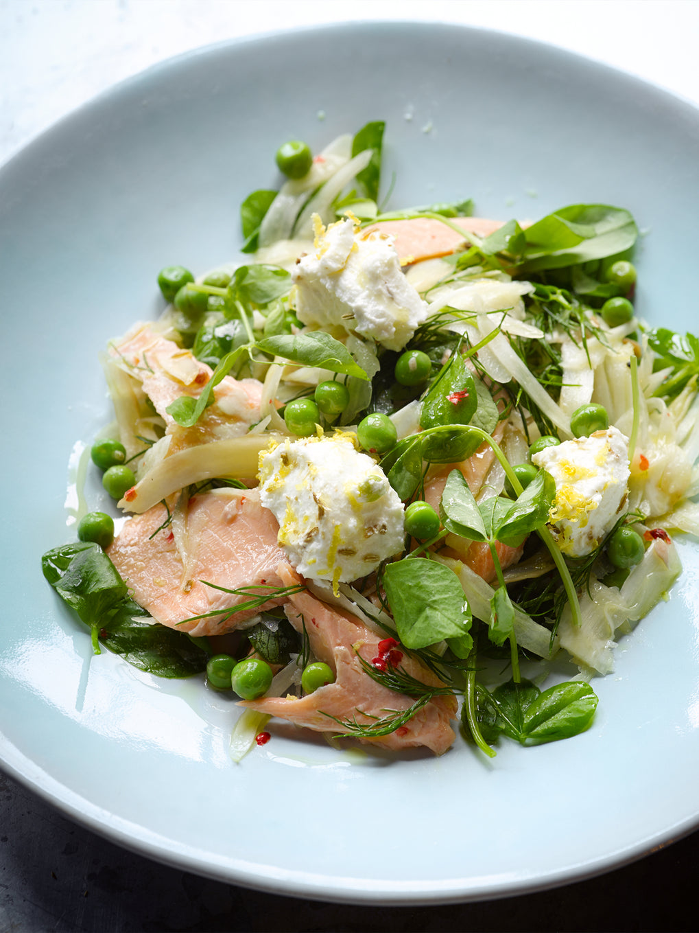 Hot smoked trout with fennel, peas and goat's cheese 