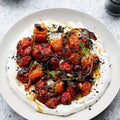 Hot charred cherry tomatoes with cold yoghurt