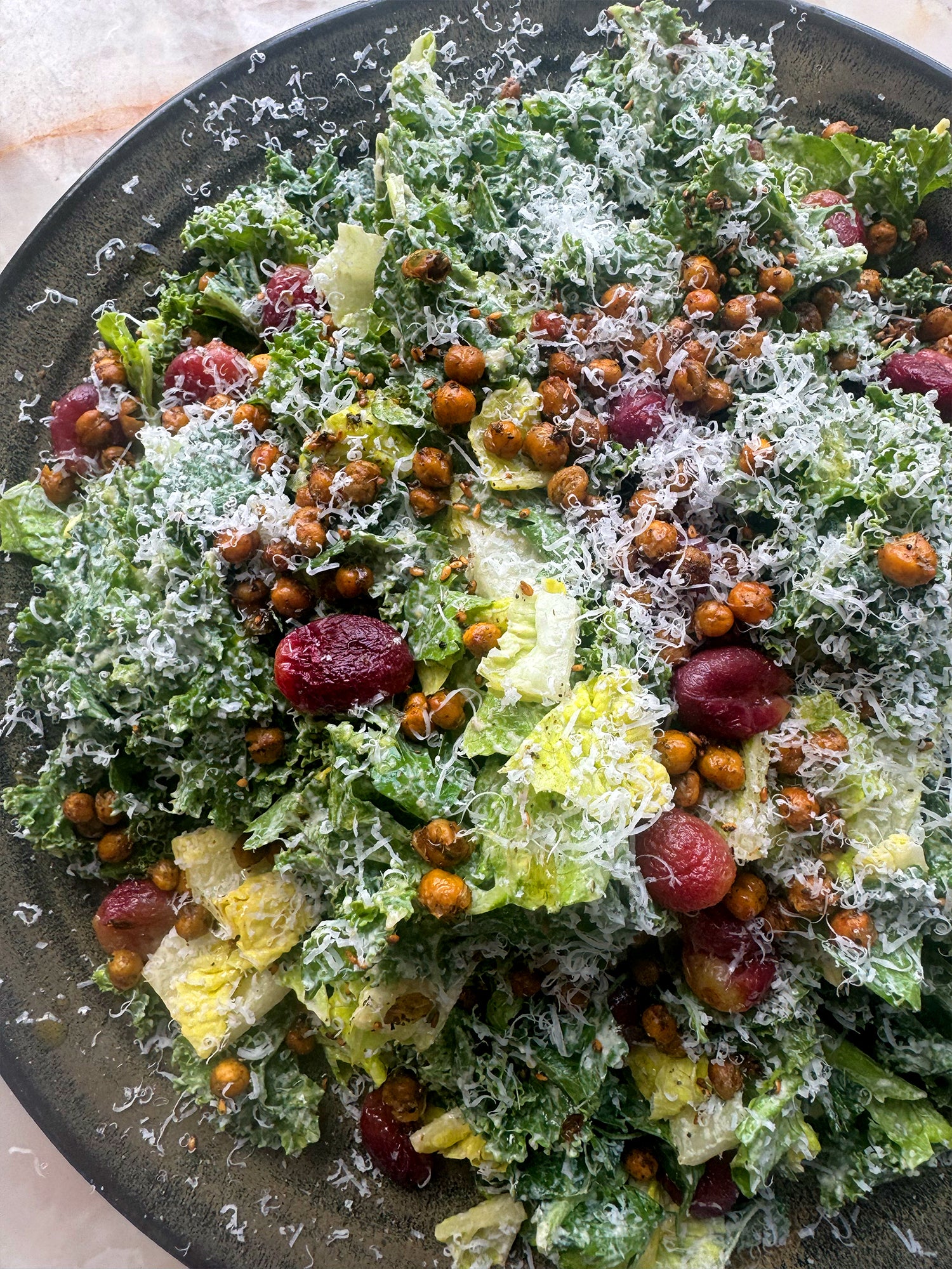 Kale and tahini caesar salad with za'atar, chickpeas and roasted grapes
