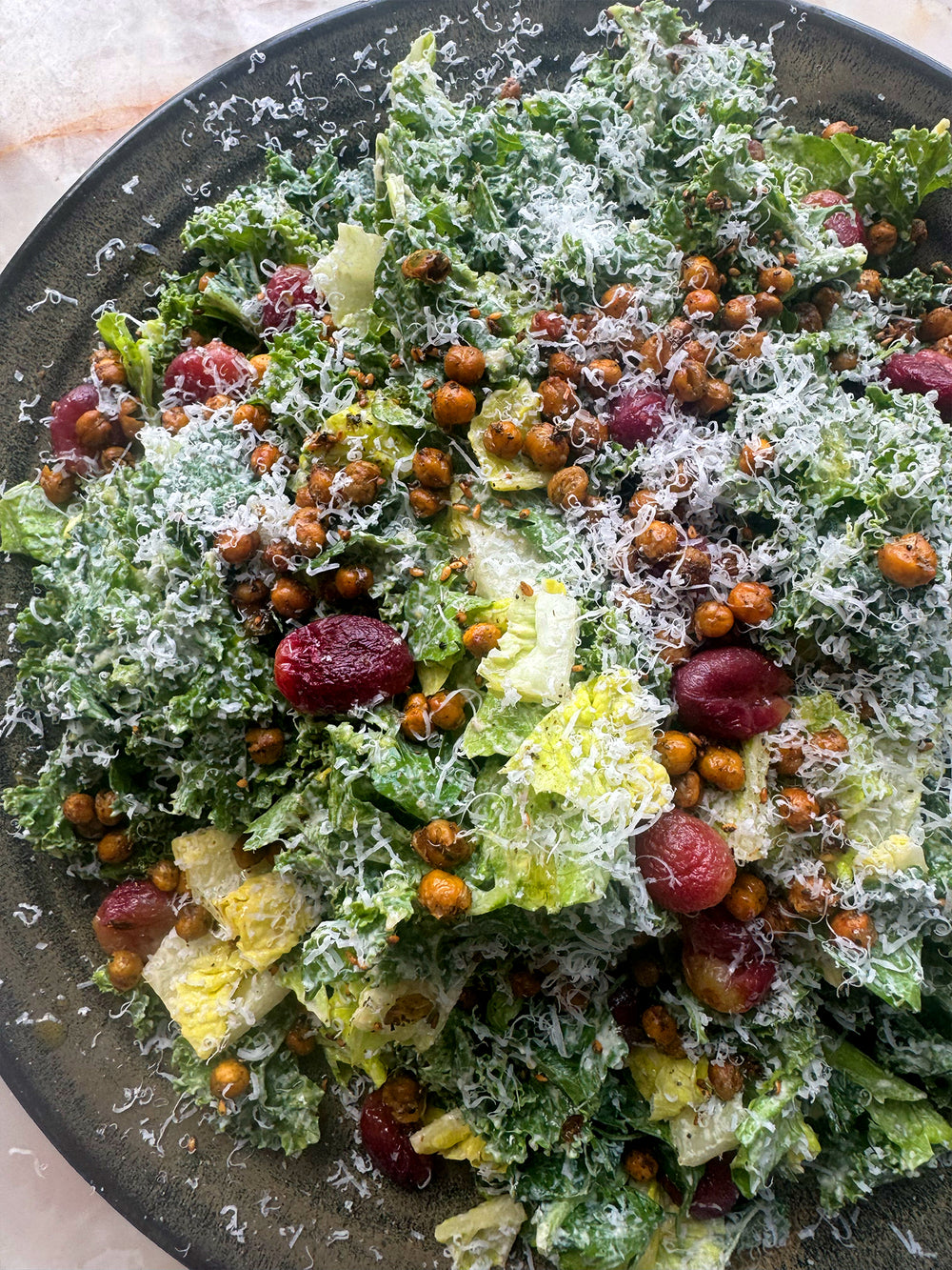 Kale and tahini caesar salad with za'atar, chickpeas and roasted grapes