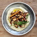 Marinated mushrooms hummus topping