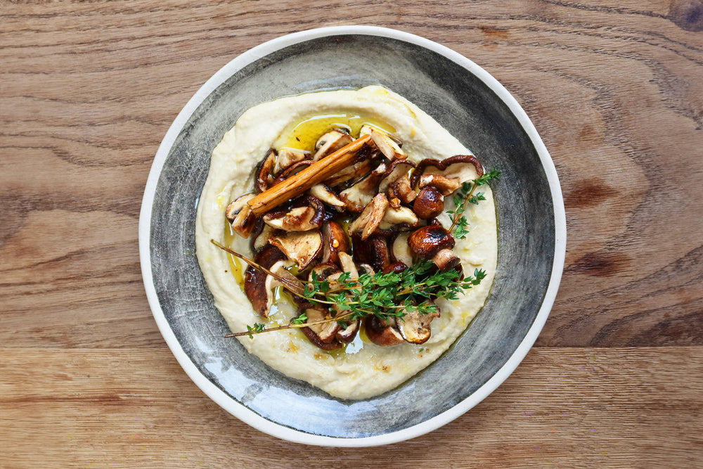 Marinated mushrooms hummus topping