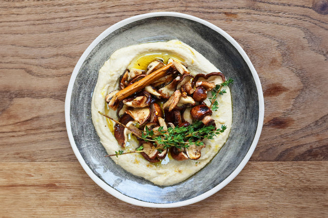 Marinated mushrooms hummus topping
