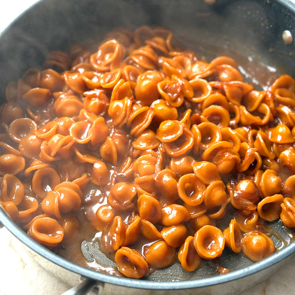 Caramelised onion orecchiette with hazelnuts and sage