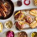 Pomegranate and lemon harissa sticky sausages