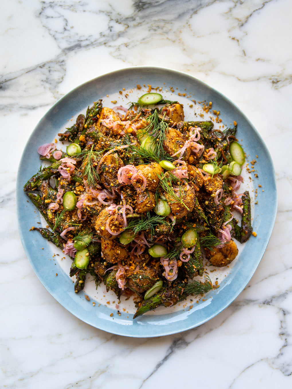 Potato and asparagus salad with black garlic and dukkah