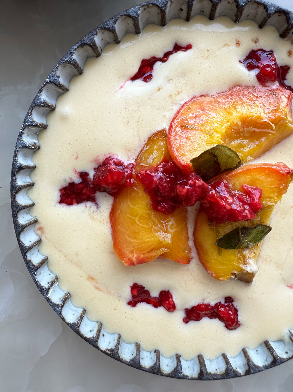 Roast peaches with makrut lime leaves, sabayon and raspberries