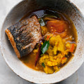 Sea bass and turmeric potatoes in rasam broth
