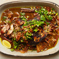 Slow-cooked lamb shoulder with fig and pistachio salsa