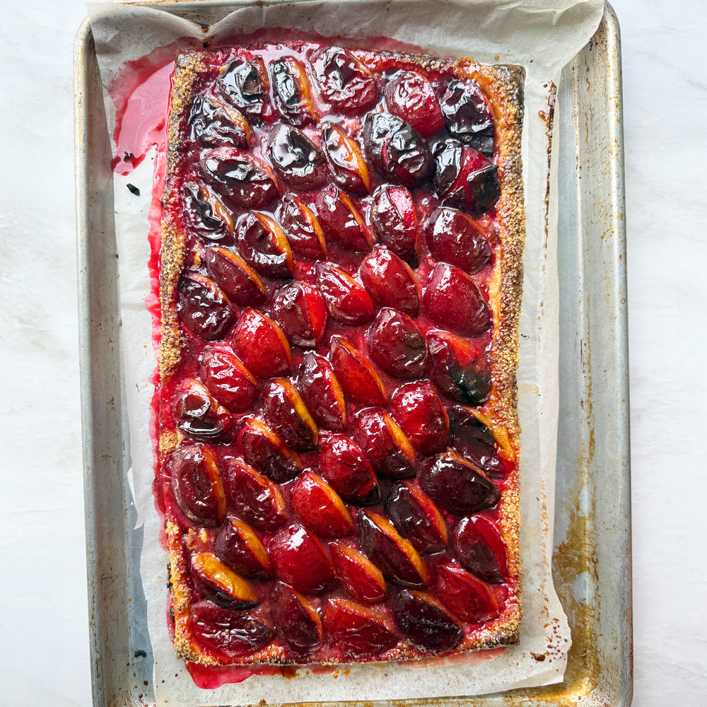 Spiced plum and marzipan tart with creme fraiche