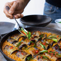 Stuffed aubergine in curry and coconut dal
