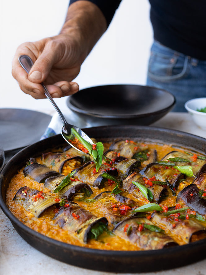 Stuffed aubergine in curry and coconut dal