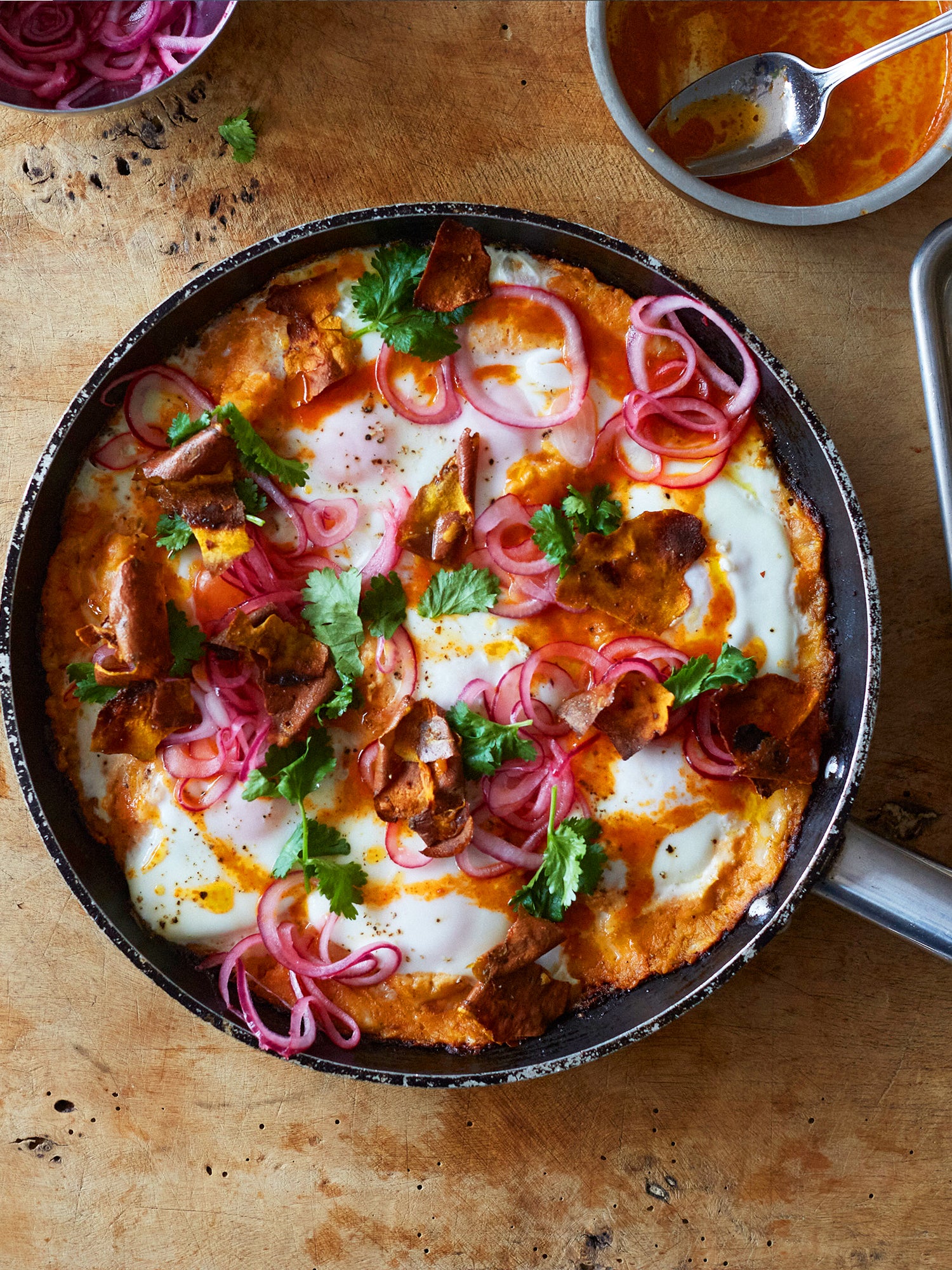 Sweet potato shakshuka with sriracha butter and pickled onions