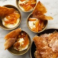 Yoghurt cream with sticky apricots and filo wafer